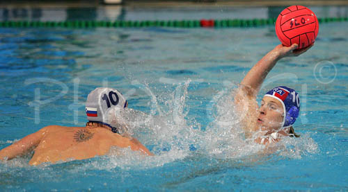 Aurelien Cousin of France (R) and Jure Nastran of Slovenia (L) fighting for ball during first match of qualification waterpolo tournament for European championship. Match between Slovenia and France took place in Kranj, Slovenia on 7.April 2006. Slovenia defeated France with 9:7. 