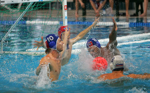 Aurelien Cousin of France (L), Michael Bodegas of France (M) and Teo Galic of Slovenia (R) are fighting for ball during first match of qualification waterpolo tournament for European championship. Match between Slovenia and France took place in Kranj, Slovenia on 7.April 2006. Slovenia defeated France with 9:7. 